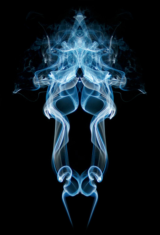 A blue wisp of smoke, mirrored and overlaid on itself